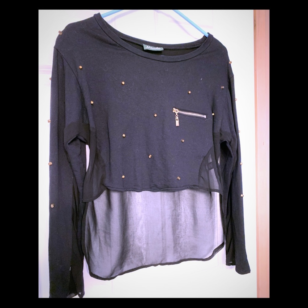 Black shirt with gold spheres on it
